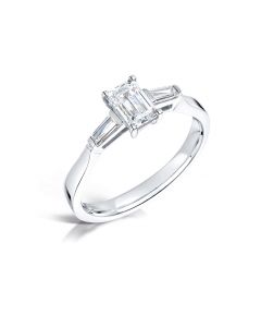 Platinum emerald cut single stone engagement ring with baguette shoulders. 0.71cts