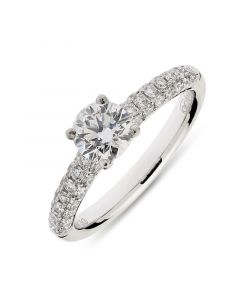 Platinum brilliant round cut single stone ring with diamond shoulders. 0.70cts