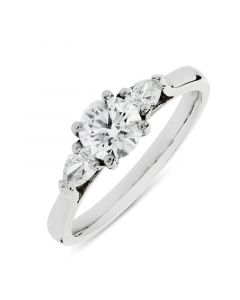 Platinum brilliant round cut diamond three stone engagement ring. 0.70cts