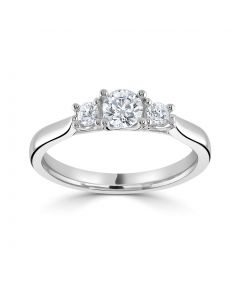 Platinum brilliant round cut diamond three stone engagement ring. 0.70cts