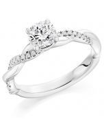 Platinum brilliant round cut diamond single stone twist engagement ring. 0.70cts